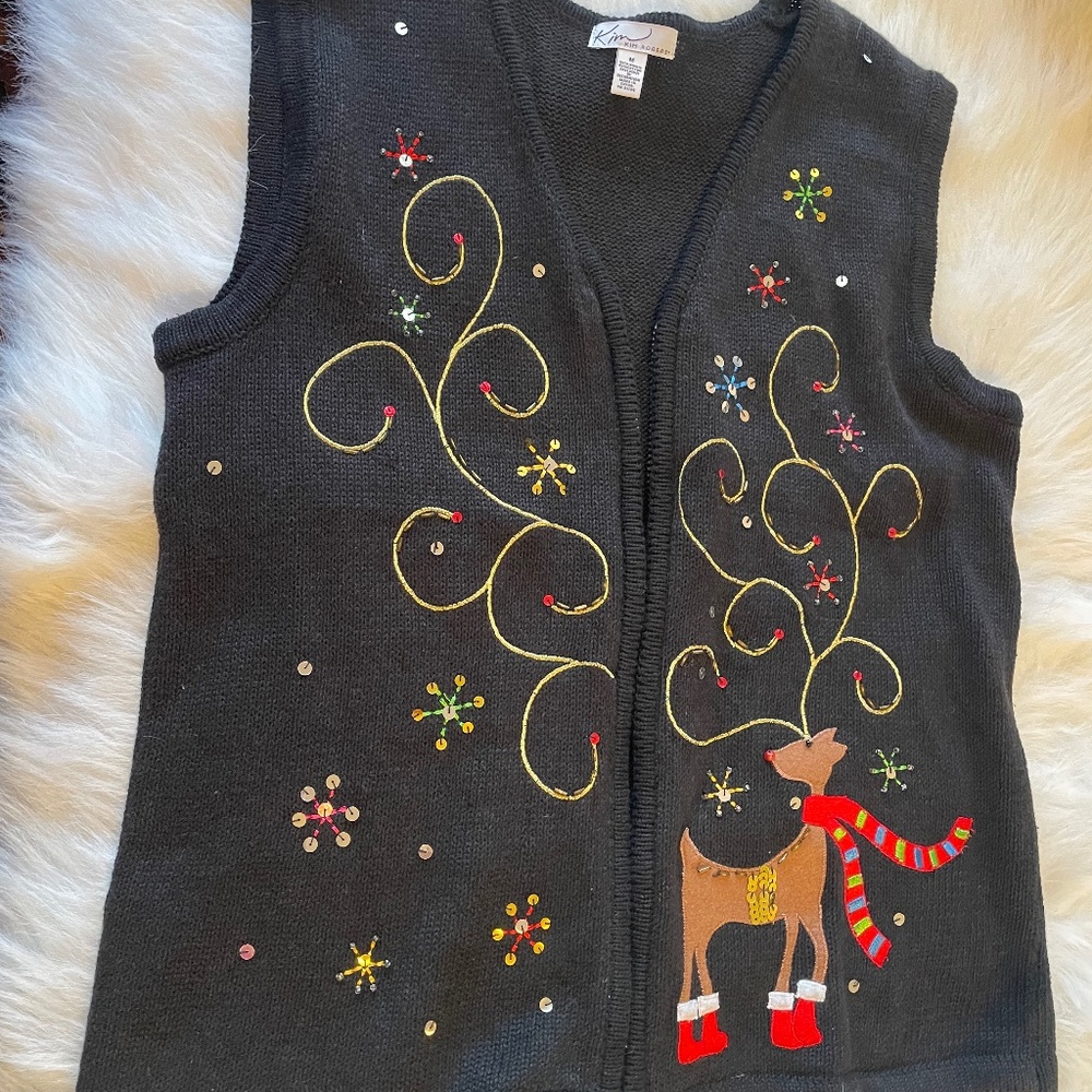 Black knitted vest with Christmas embroidery.